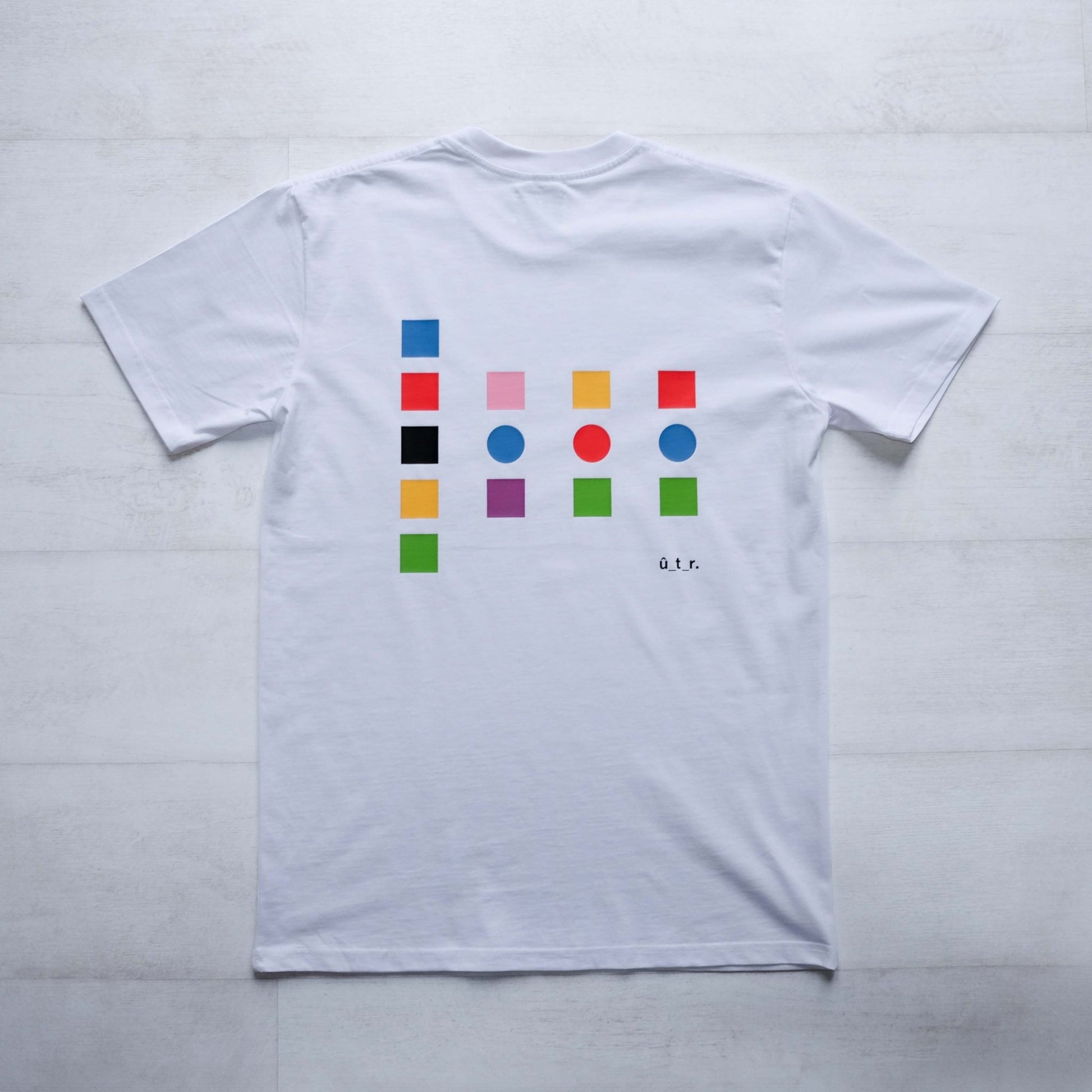 Back of white t-shirt with large back print showing colour swatches that pay homage to the jerseys from the 3 grand tours.. #swatch