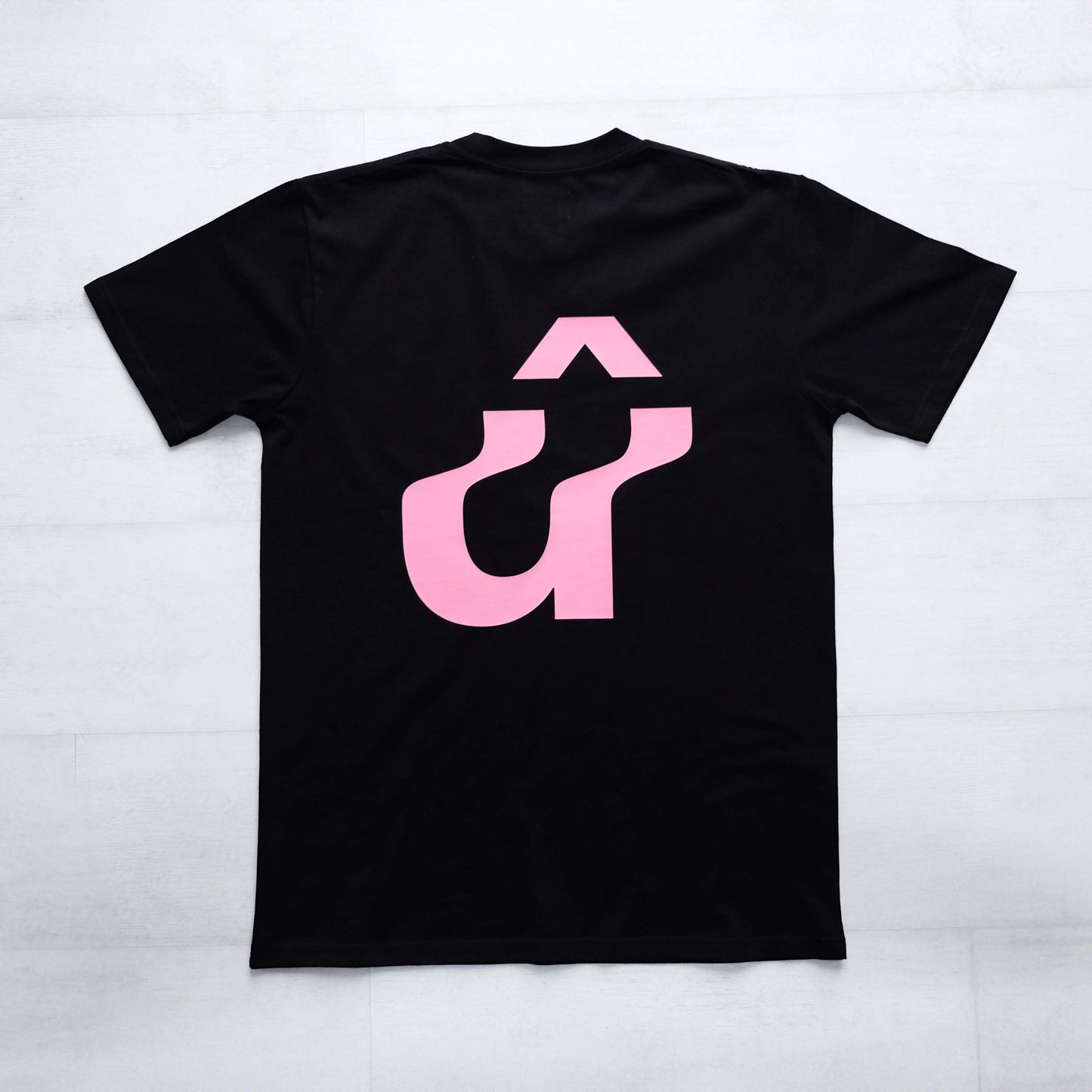 Back image of black t-shirt with large pink warped û back print  #Warped# - #Up The Road